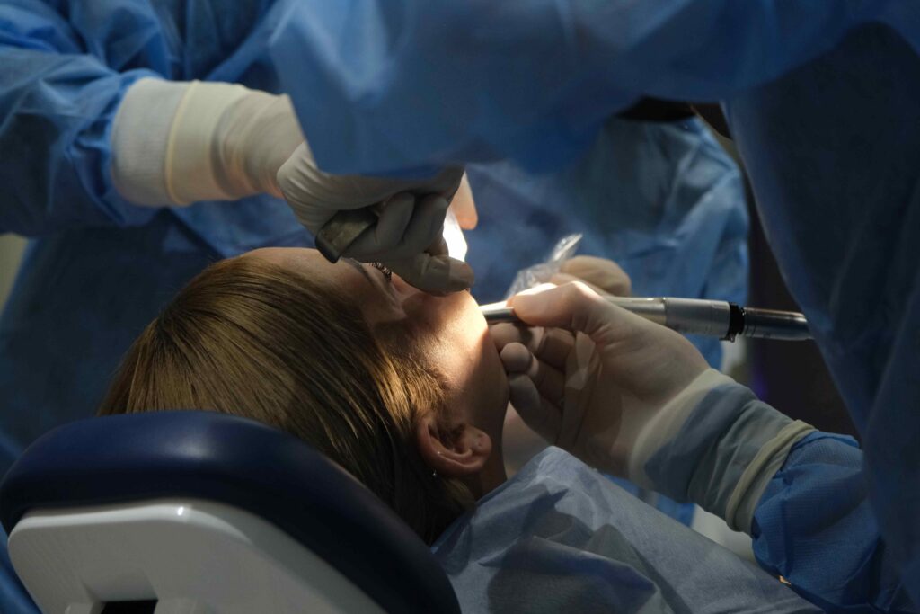 Woman undergoing dental surgery